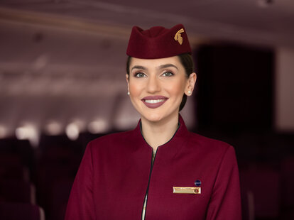 A Qatar Airlines flight attendant.
