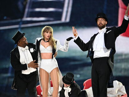 Taylor Swift is joined on stage by Travis Kelce (R), during “Taylor Swift | The Eras Tour” at Wembley Stadium.