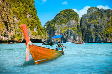 ko phi phi thailand, aerial shot, with boat heading to the water