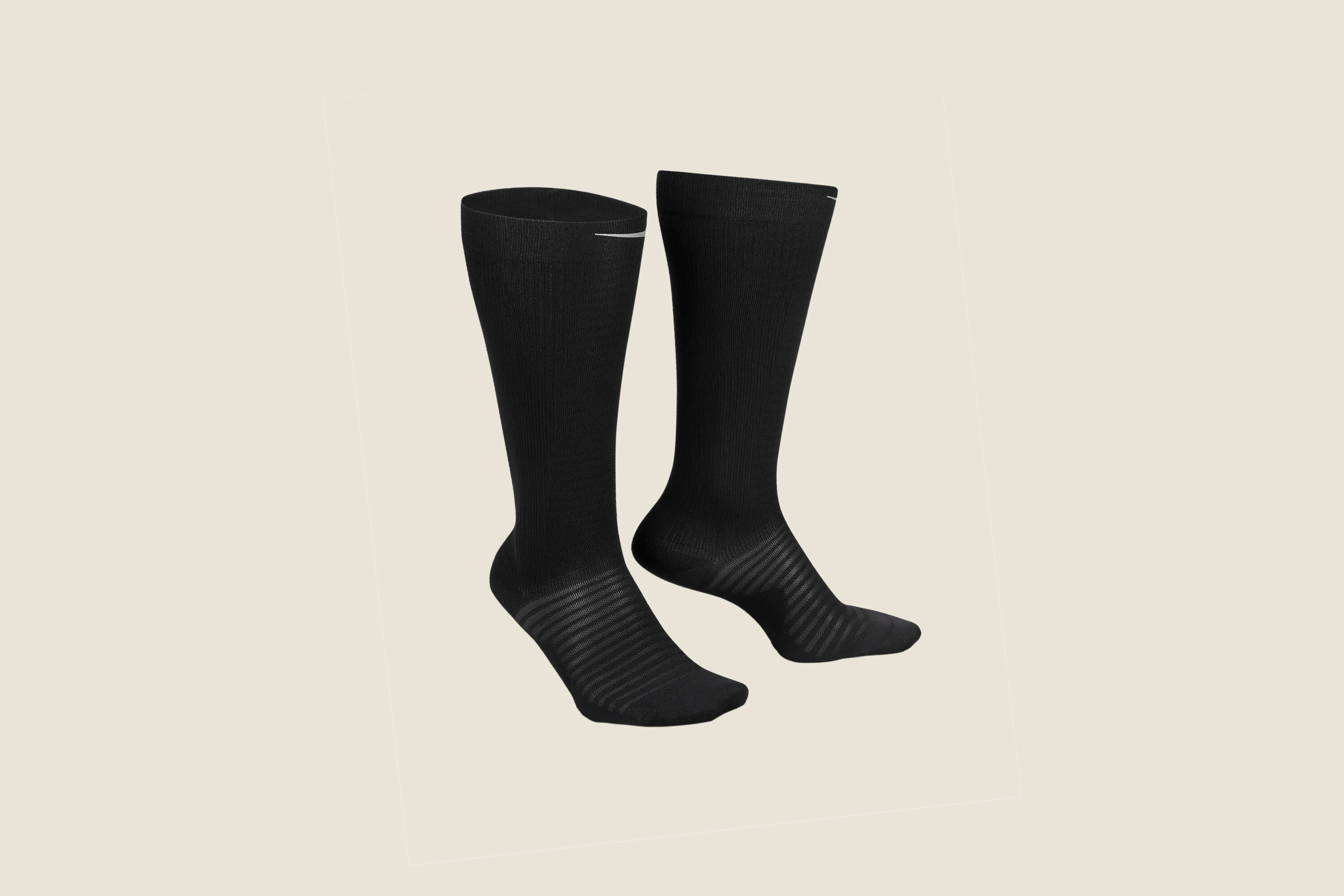 A pair of black Nike compression socks.
