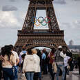 Giant rings are being installed on the Eiffel Tower in Paris, France, on June 14, 2024