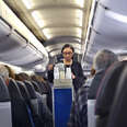 An American Airlines flight attendant serves drinks to passengers after departing from San Antonio International Airport in Texas.