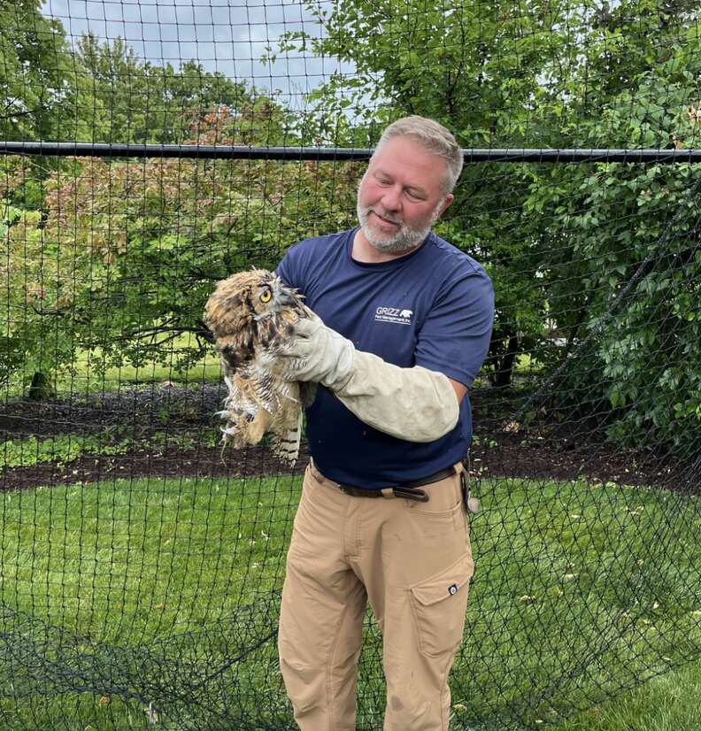 man holding owl