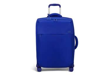 A photo of a bright blue soft-sided Lipault suitcase. 