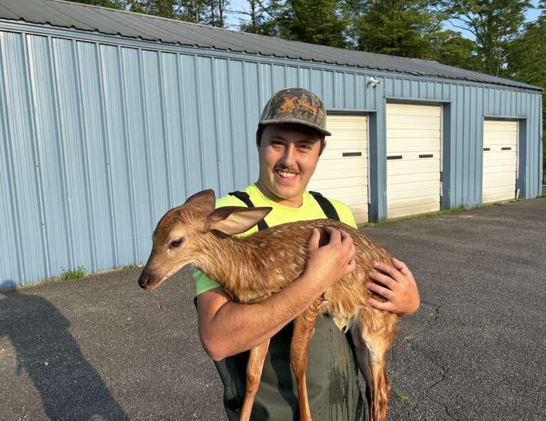 Man holding a deer