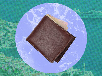 View over colourful rooftops to Harani Bay, cruise ship anchored offshore, Gialos (aka Yialos), Symi (aka Simi), Rhodes, Dodecanese Islands, South Aegean, Greece, Europe.