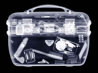 Vanity case with contents, X-ray, showing an interior that contains a vibrator. 