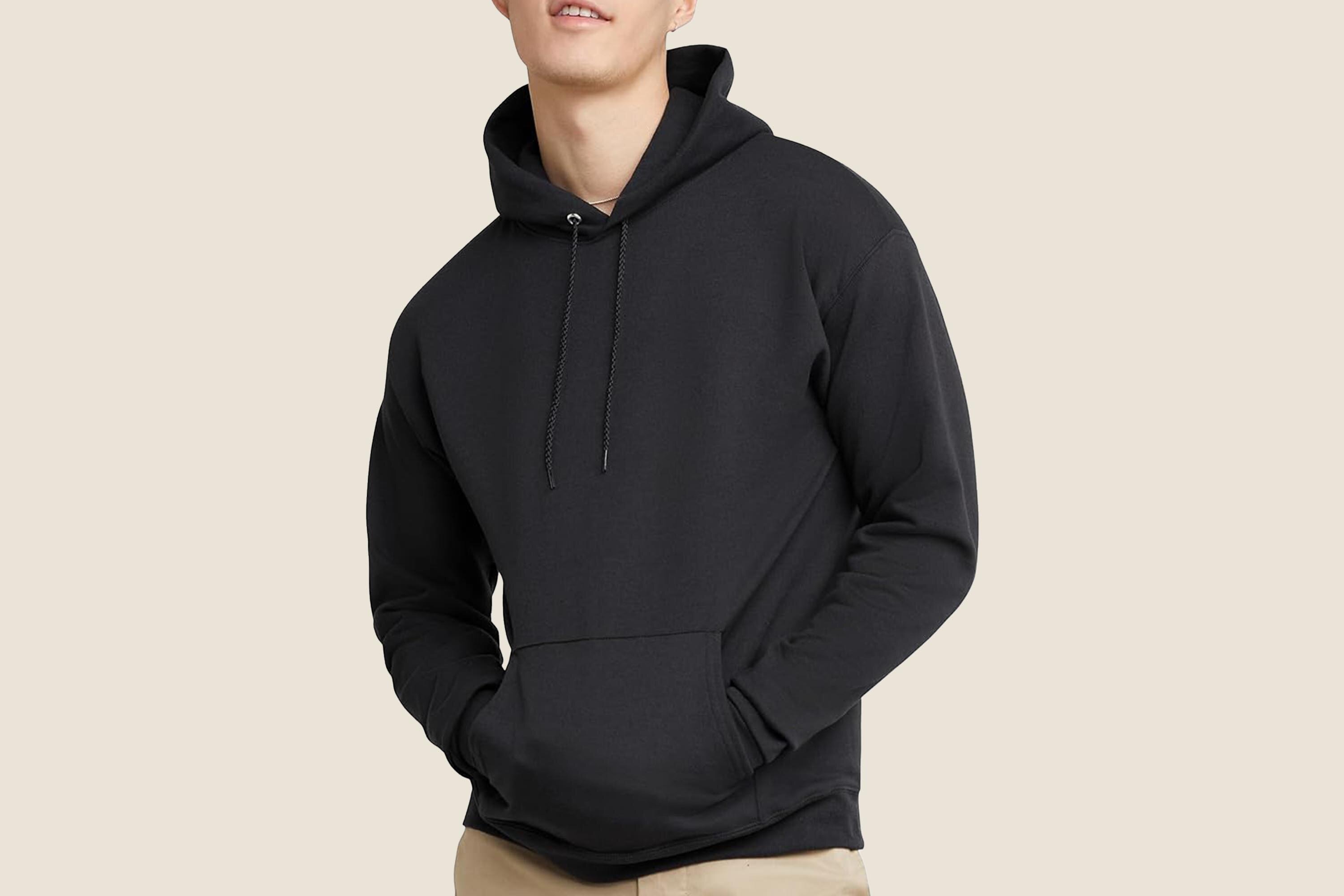 A photo of a man wearing a black Hanes hoodie.