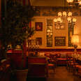 sumptuous interior of red leather and gold at mother wolf italian restaurant in hollywood