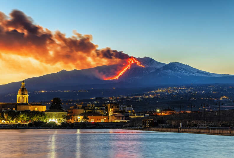 Panorama of the Ionian coast during the eruption of volcano Mount Etna