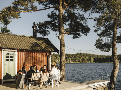 friends having dinner at a vacation home