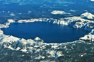 crater lake national park in oregon seen from above in the snow