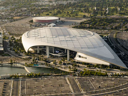 sofi stadium in inglewood seen from above with the forum in the background