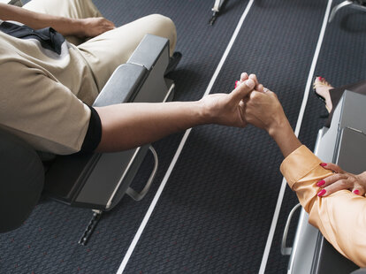 couple sitting on plane