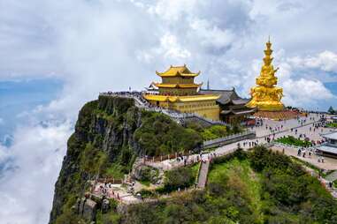 golden Buddhist structures on a peak of Emei Mountain in China