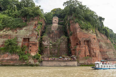 the tallest buddha in the world, just outside of the city of leshan, carved into a mountain 