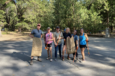 visitors in yosemite national park cleaning up trash for facelift day