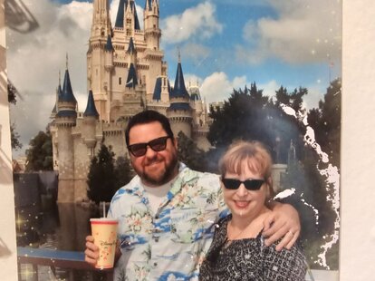 Dave Ensign with his friend&rsquo;s ashes in a Disney cup