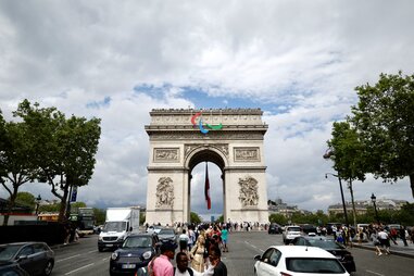 Olympic themed decorations are hung on the Arc de Triomphe before the opening of Paris 2024 Olympics on July 21, 2024 in Paris, France.