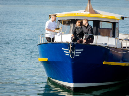 Chef Gareth Mullins on a boat with tourists.