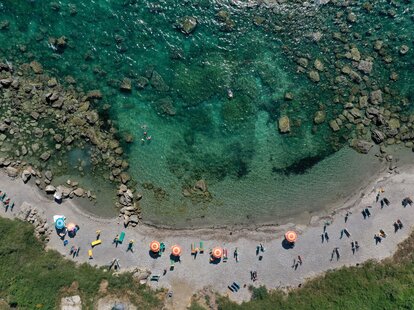 An aerial photo taken on July 12, 2021, shows parasols in Kallmi beach, near the city of Durres, Albania.
