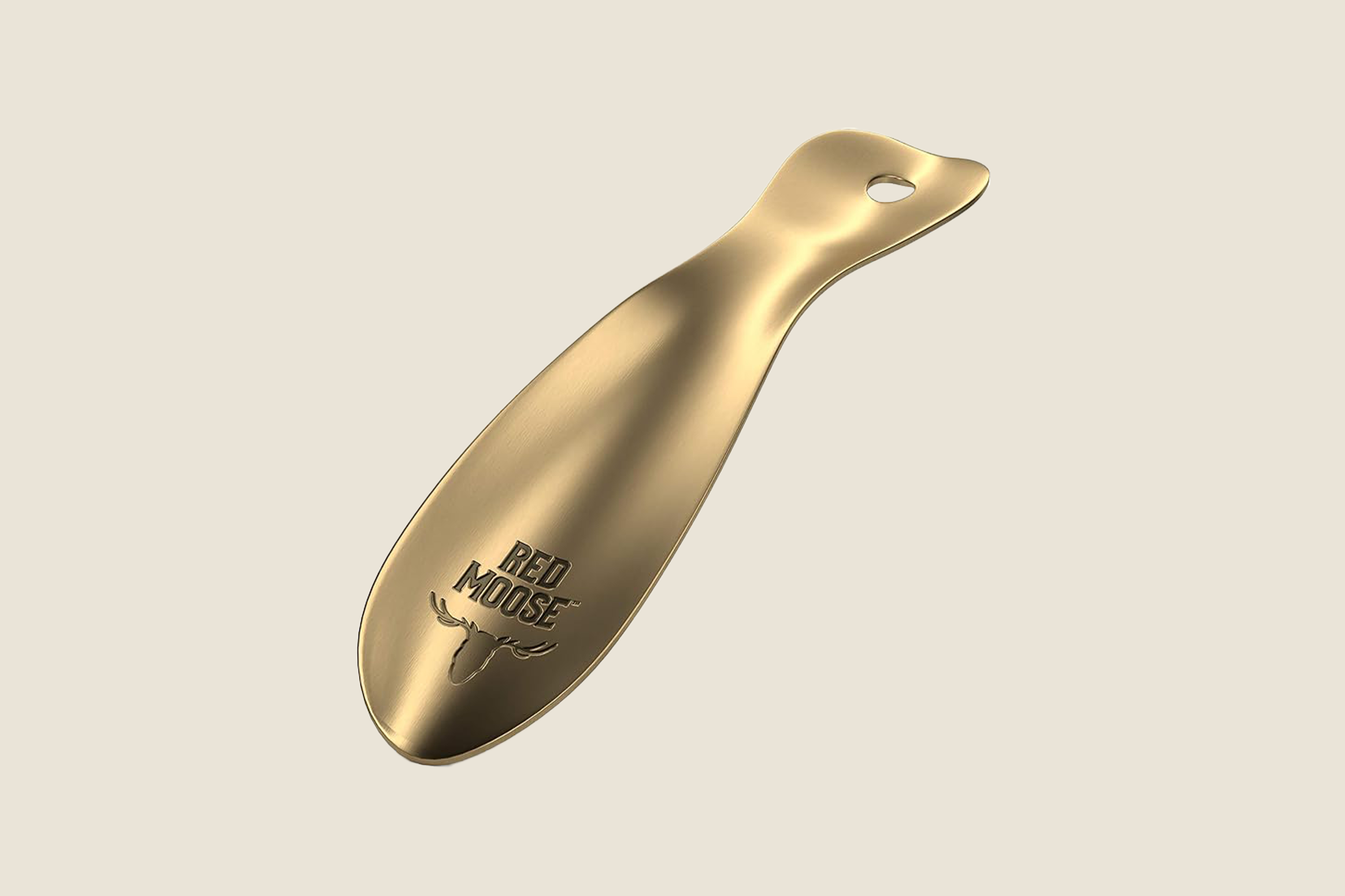An image of a single gold shoe horn.