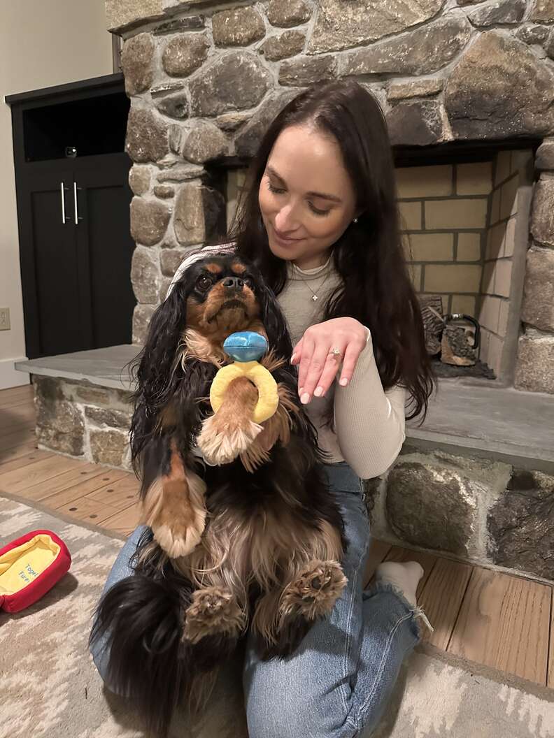 dog and her mom wearing engagement rings