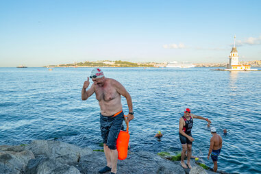swimmer exist bosphorus strait onto rocky inlet