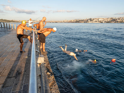 swimmers diving into the bosphorus strait in istabul turkey