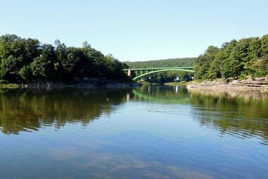 upper delaware river and a bridge winding between new york and pennsylvania