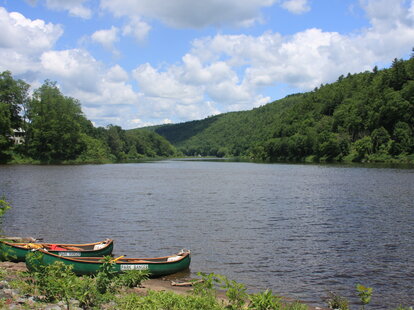 canoes on the river bank at upper delaware river in new york