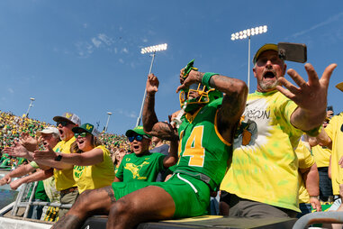 Defensive back Khamari Terrell #14 of the Oregon Ducks jumps into the stands before the game against the Idaho Vandals at Autzen Stadium on August 31, 2024 in Eugene, Oregon