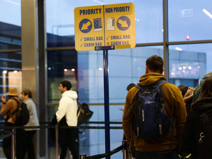 People stay in line before boarding Ryanair plane at the airport in Balice near Krakow, Poland