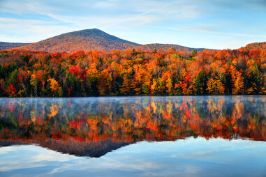 Early morning autumn light near Killington, Vermont. Photo taken on a calm tranquil colorful morning during the peak autumn foliage season.