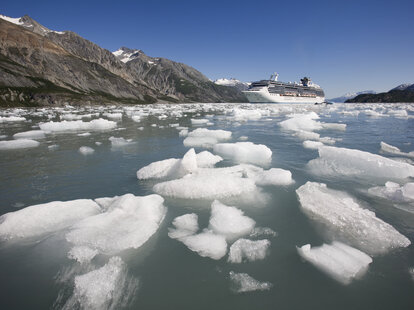 A cruise ship sailing through icebergs.