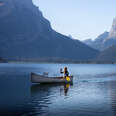 Woman canoeing by herself on a lake in Wyoming