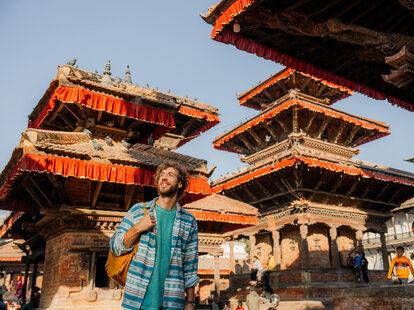 Man with backpack exploring Kathmandu old town