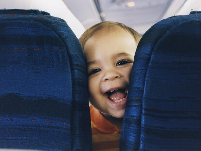 child in first class on airplane