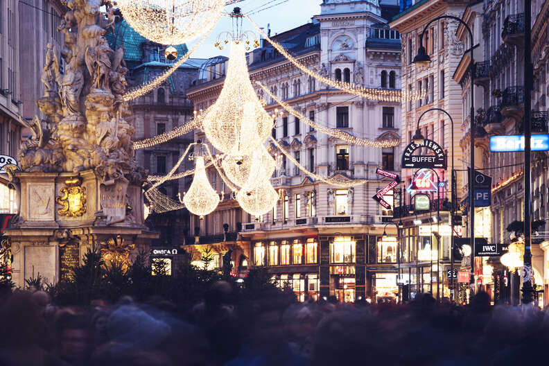 a lit-up street christmas market, or chriskindlmarkt, in Vienna 