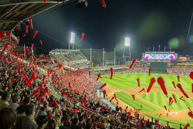 japanese baseball fans releasing rocket shaped balloons during hiroshima carps game