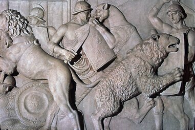 Roman relief of gladiators fighting wild beasts., 1st century.