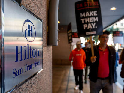 Hotel workers and supporters picket in front of the Hilton hotel during a strike in San Francisco, California, US, on Monday, Sept. 23, 2024.