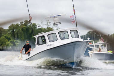 boat rodeo chesapeake deadrise man with lasso