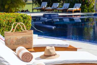 view of lounge chairs by the pool at casa velas