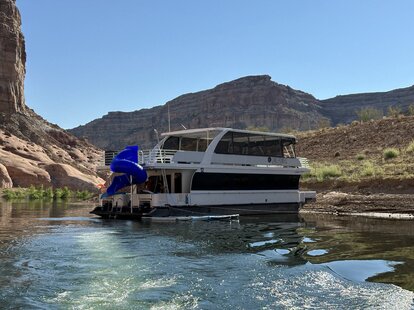 houseboat at anchor on lake powell in arizona