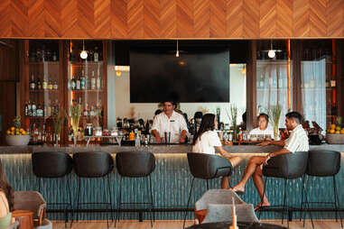 people sitting at a bar