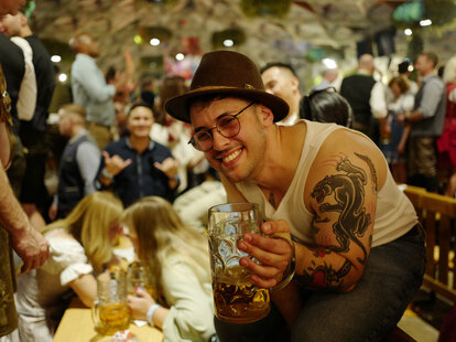Revelers enjoy the atmosphere inside the Hofbraeuhaus beer tent during the opening day of the 2024 Munich Oktoberfest, Munich’s annual beer festival, on September 21, 2024 in Munich, Germany.