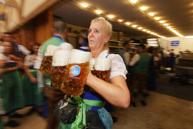 https://www.gettyimages.com/detail/news-photo/waitress-carries-beer-mugs-inside-the-hofbraeuhaus-beer-news-photo/2173509218?adppopup=true