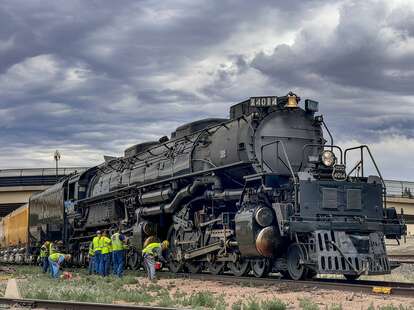 A side profile view of the infamous train "Big Boy" which is the largest operating steam engine train in the world.