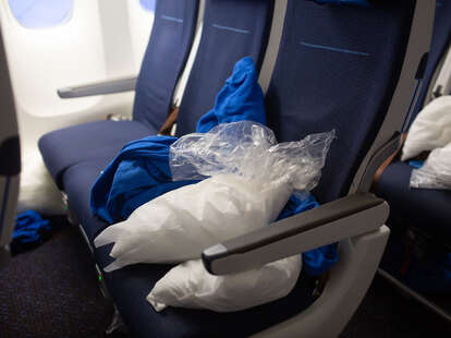 plane seats with pillow and blanket